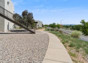 Thumbnail 37 of 56 - a walkway next to a building and a street at Vista Linda, New Mexico 87507