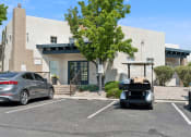 Thumbnail 40 of 56 - a golf cart parked in a parking lot in front of a building at Vista Linda, Santa Fe, 87507