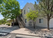 Thumbnail 33 of 56 - a white house with stairs and trees in front of it at Vista Linda, Santa Fe, NM