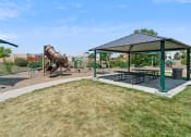 Thumbnail 32 of 56 - a playground with a slide and picnic table in a park at Vista Linda, Santa Fe, 87507