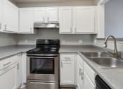 Thumbnail 4 of 56 - a kitchen with white cabinets and stainless steel appliances at Vista Linda, Santa Fe, New Mexico
