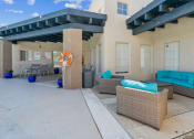 Thumbnail 54 of 56 - a patio with couches and chairs in front of a house at Vista Linda, Santa Fe, 87507