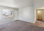 Thumbnail 18 of 56 - the living room of an empty apartment with white walls at Vista Linda, Santa Fe, NM 87507