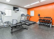 Thumbnail 48 of 56 - a workout room with weights and a tv in the corner at Vista Linda, Santa Fe, New Mexico