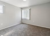 Thumbnail 14 of 56 - an empty room with carpet and a window at Vista Linda, New Mexico 87507