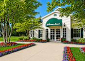 Thumbnail 1 of 21 - Welcoming clubhouse entrance with colorful flower beds at Northview Park Apartments, Michigan, 48310