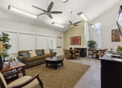 Thumbnail 6 of 16 - a living room and dining room with couches and chairs and a dining room table
