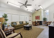 Thumbnail 9 of 16 - a living room and dining room with couches and a table