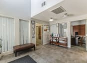 Thumbnail 8 of 16 - the lobby of a home with a couch and a table