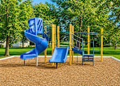 Thumbnail 7 of 21 - Playground with blue slides and climbing structure at Northview Park Apartments, Sterling Heights, MI