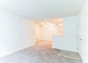 Thumbnail 4 of 13 - a living room with white walls and carpet