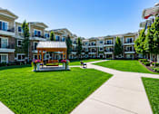 Thumbnail 13 of 20 - Courtyard with gazebo and walking paths at The Ellison Apartments, Layton, 84041