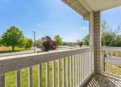 Thumbnail 19 of 26 - the view from the deck of a home with a wooden railing