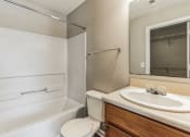 Thumbnail 17 of 26 - a bathroom with a sink and a toilet and a bath tub