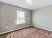 Thumbnail 12 of 26 - an empty room with carpet and a window