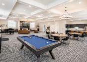 Thumbnail 3 of 20 - Spacious clubhouse with pool table and dining area at The Ellison Apartments, Utah
