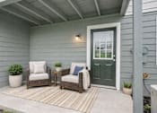 Thumbnail 13 of 13 - Porch with two chairs at Brookwood, Archdale, NC