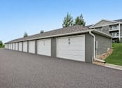 Thumbnail 4 of 13 - Detached garage units with private parking spaces at Lake Ridge Apartments, Minnesota, 55379