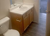 Thumbnail 9 of 16 - a bathroom with a sink toilet and a mirror