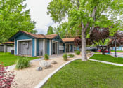 Thumbnail 11 of 13 - a group of houses in a row with trees and grass in front of them