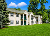 Thumbnail 3 of 21 - Two story apartment homes with green shutters at Northview Park Apartments, Michigan