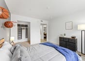 Thumbnail 6 of 23 - a bedroom with a bed and a closet with a basketball
