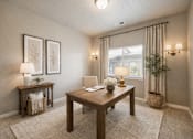 Thumbnail 16 of 21 - Home office with wood desk and natural light at Harper Ridge Apartments, Idaho, 83642