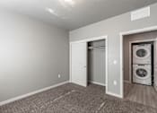 Thumbnail 10 of 29 - A laundry room with a washer and dryer.