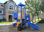 Thumbnail 10 of 16 - a playground in front of an apartment building
