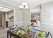 Thumbnail 7 of 28 - a dining room with a glass table and chairs