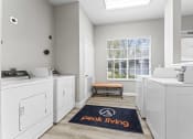 Thumbnail 11 of 23 - a washer and dryer in a white laundry room with a window