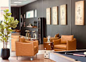 Thumbnail 13 of 24 - Recreation room with pool table and lounge seating at Lofts at Innovation Center Apartments, Washington