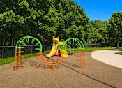 Thumbnail 2 of 14 - A playground with a yellow slide and green and orange climbing structures.