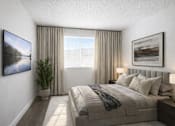 Thumbnail 4 of 6 - Modern bedroom with neutral tones and natural light at Fort Lane Apartments, Utah