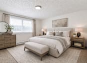 Thumbnail 9 of 10 - A bedroom with a large bed, a dresser, and a nightstand.