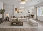 Thumbnail 9 of 10 - A modern living room with a white sofa set, a wooden coffee table, and a large mirror on the wall.