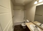 Thumbnail 4 of 31 - a small bathroom with a shower toilet and sink