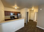 Thumbnail 1 of 31 - a view of a kitchen and living room in an apartment