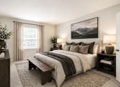 Thumbnail 9 of 9 - A bedroom with a large bed, a bench, and a painting on the wall.