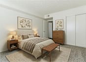 Thumbnail 11 of 11 - A bedroom with a bed, nightstand, and wardrobe.