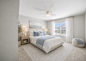 Thumbnail 23 of 31 - A bedroom with a large bed and a ceiling fan. at Waterbridge Apartments , Florida