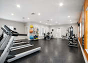 Thumbnail 11 of 31 - A gym with treadmills, exercise balls, and other equipment. at Waterbridge Apartments , Orlando, Florida