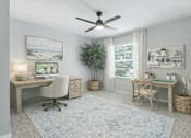 Thumbnail 29 of 31 - A room with a desk, chair, and a ceiling fan. at Waterbridge Apartments , Orlando, Florida