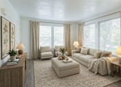 Thumbnail 14 of 28 - A well-lit, spacious living room with a large window and a comfortable seating area.