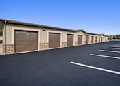 Thumbnail 6 of 17 - A long row of garage doors are closed.
