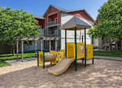 Thumbnail 5 of 21 - Playground with slide and tunnel in courtyard at Stetson Meadows Apartments, Colorado, 80922