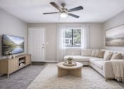 Thumbnail 9 of 18 - Spacious living room with modern furnishings at Davidson Homes Apartments, Concord, NC