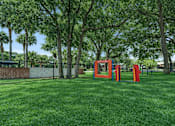 Thumbnail 8 of 28 - A playground with a red slide and a red climbing frame. at Epic Apartments , Florida