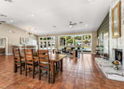 Thumbnail 19 of 28 - A large dining room with a wooden table and chairs. at Epic Apartments , Daytona Beach, 32114