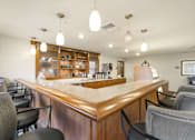 Thumbnail 29 of 37 - Community bistro bar with pendant lighting at The Estates at Arbor Oaks Apartments, Andover, 55304